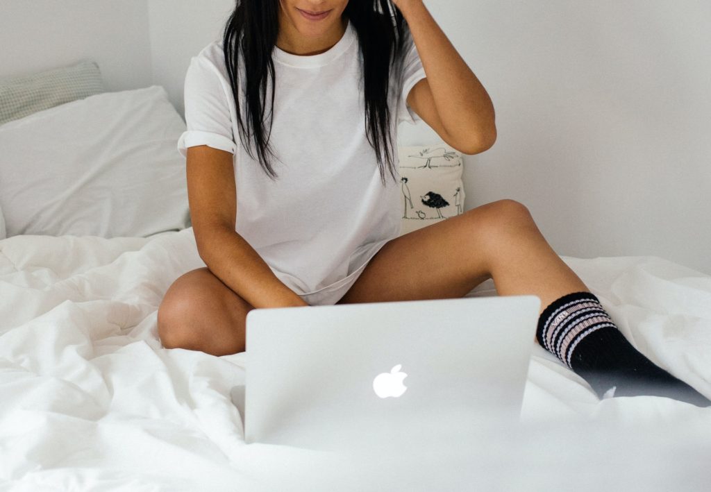 Person in bed using laptop