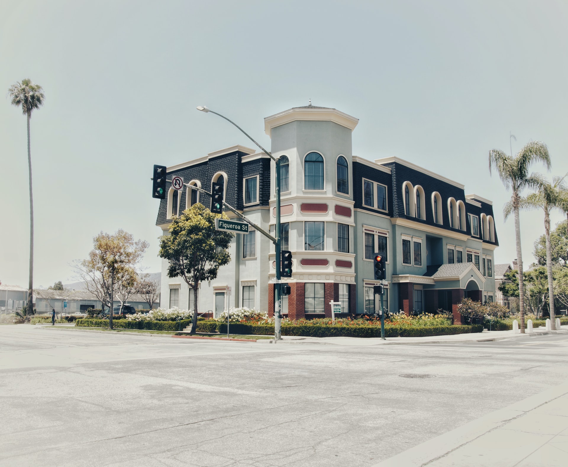 Building on a palm lined street corner in Ventura, CA.