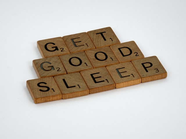 scrabble letters spelling out the words “get good sleep.”