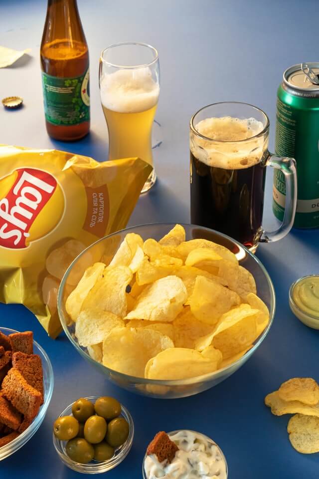 Table full of chips and beer