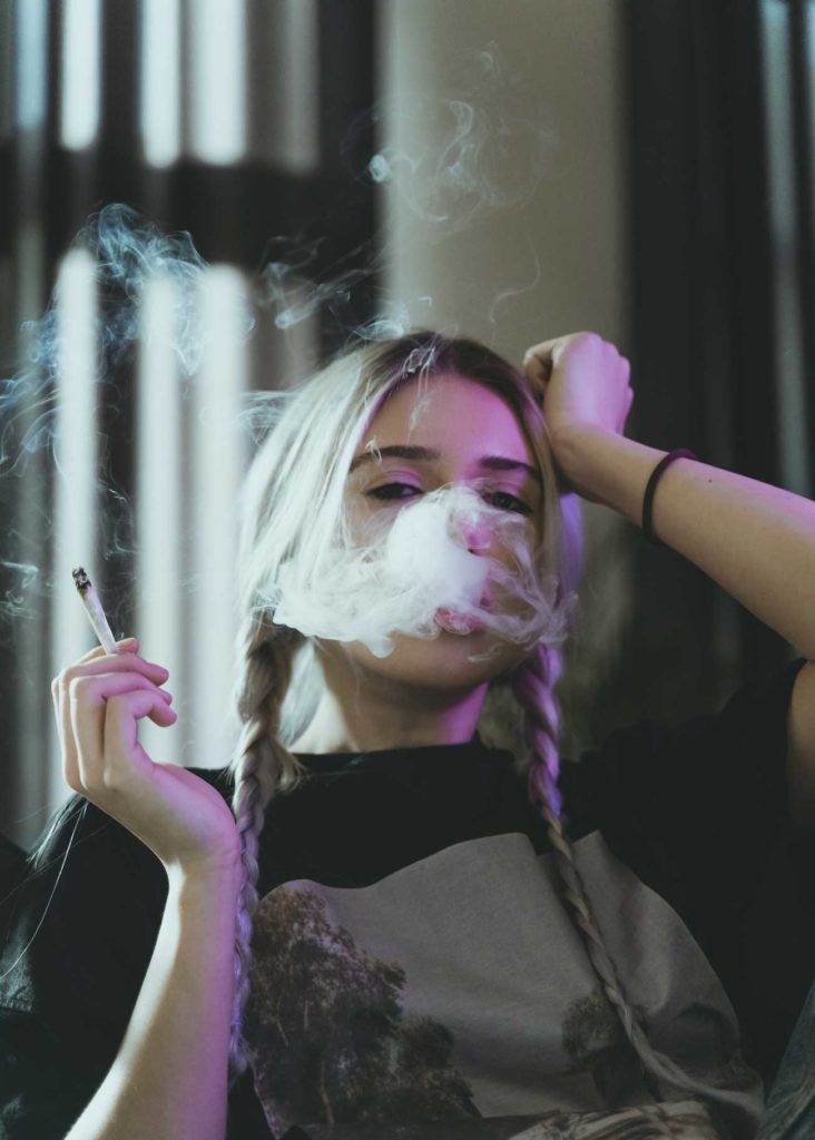 Woman smoking a joint experiencing a different type of high