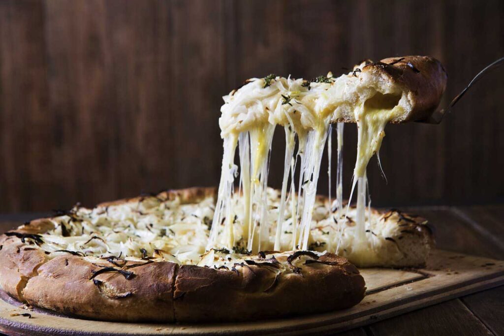 Pizza with herbs and cheese.